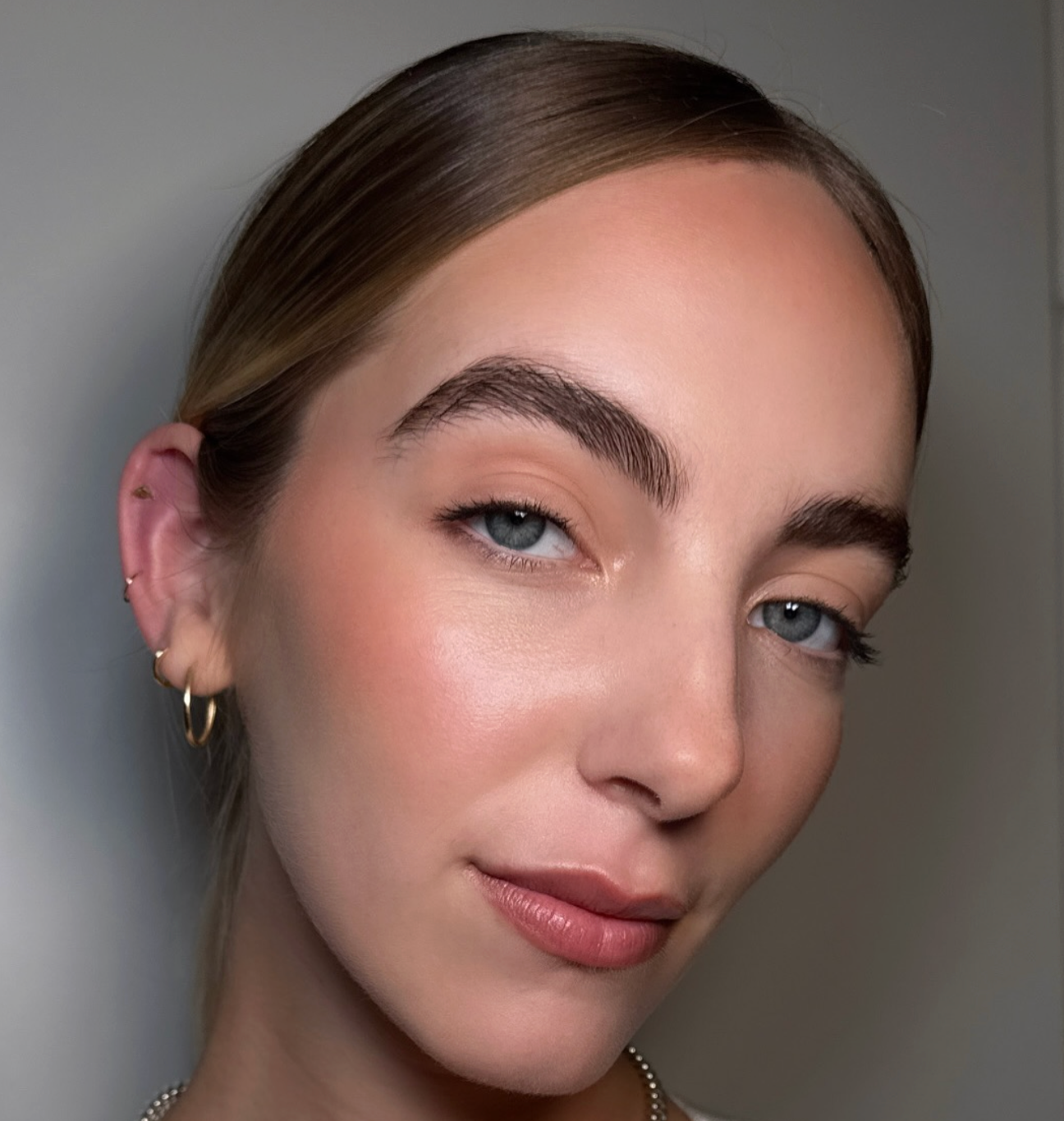 Natural brow styling and soft makeup